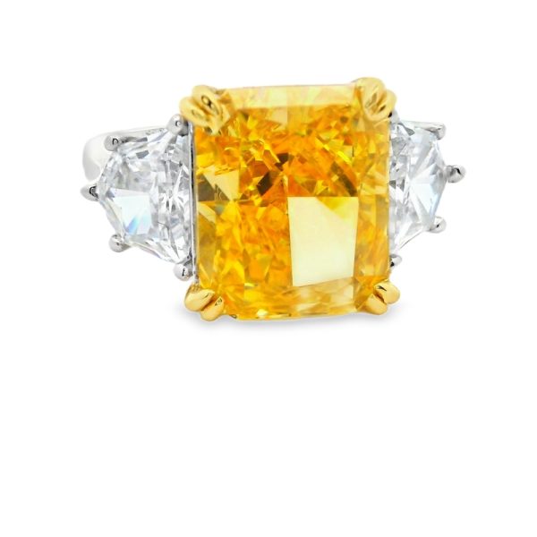 Shop our Yellow Radiant Zircon Ring in 925 sterling silver. This luxury piece features a large yellow stone and trillion-cut accents. Order yours today!