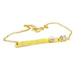 Gold plated sterling silver 925 bar bracelet with hammered texture, a single white pearl, and a round clear cubic zircon.