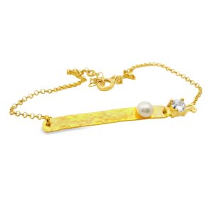 Gold plated sterling silver 925 bar bracelet with hammered texture, a single white pearl, and a round clear cubic zircon.